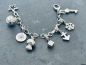 Preview: Jette Joop Original Charmarmband mit 6 verschiedenen Charmanhänger aus 925 Silber punziert, Vintage Bettelarmband, ca. 69,93g Feinsilber,  Länge ca. 20cm, Breite ca. 7mm (Kette) (34)